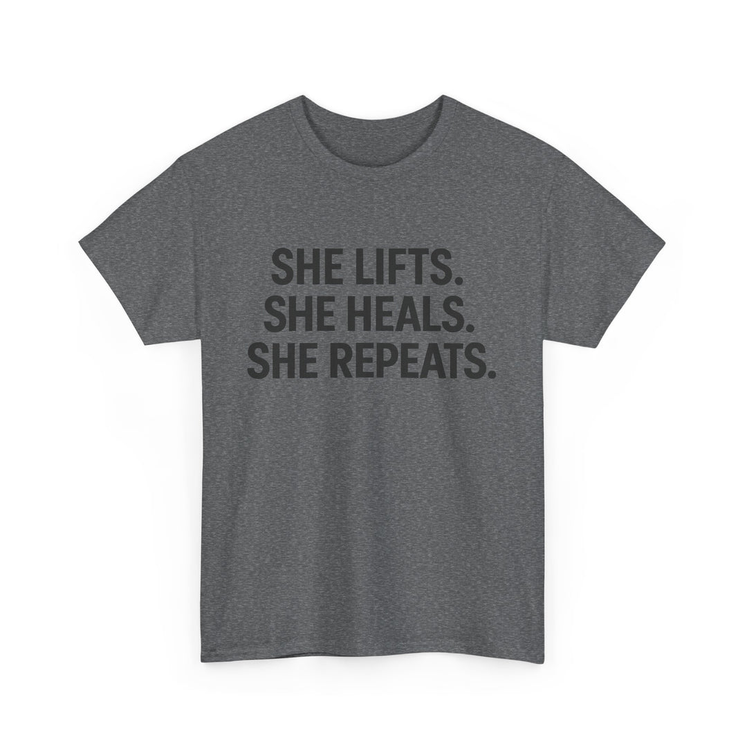 She Lifts. She Heals. She Repeats.  Unisex Heavy Cotton Tee