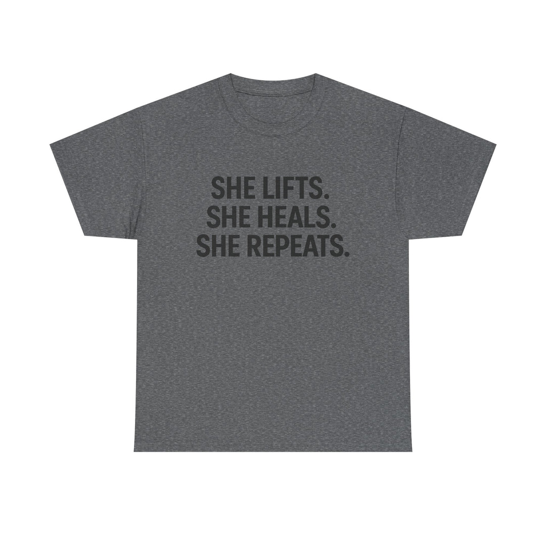 She Lifts. She Heals. She Repeats.  Unisex Heavy Cotton Tee