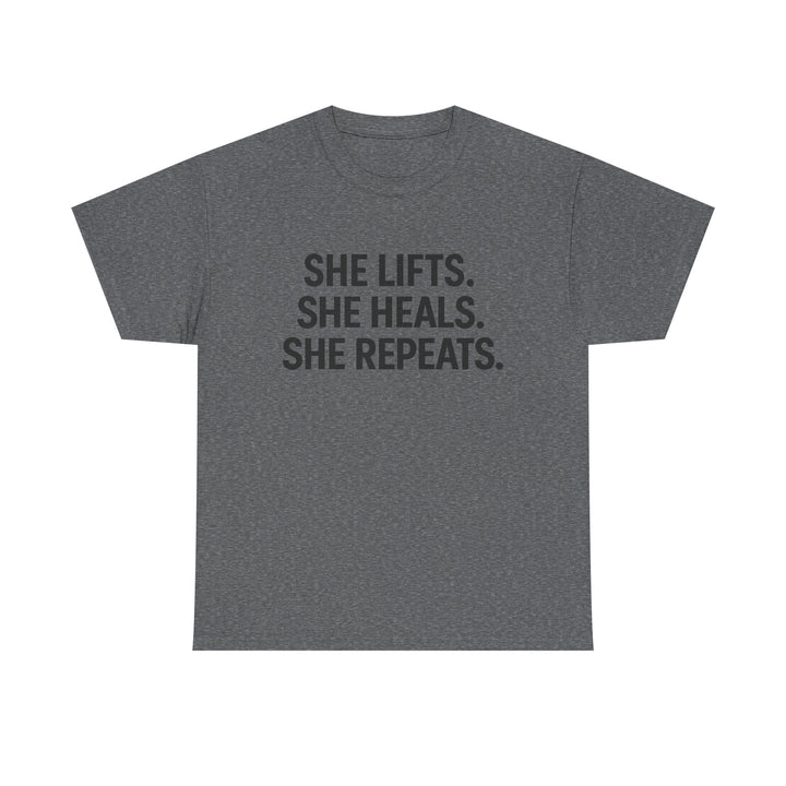 She Lifts. She Heals. She Repeats.  Unisex Heavy Cotton Tee