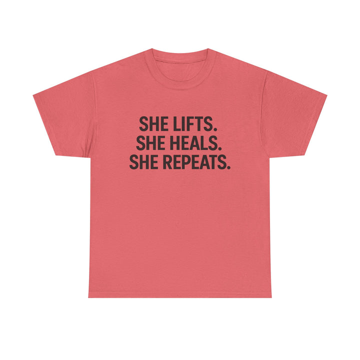 She Lifts. She Heals. She Repeats.  Unisex Heavy Cotton Tee
