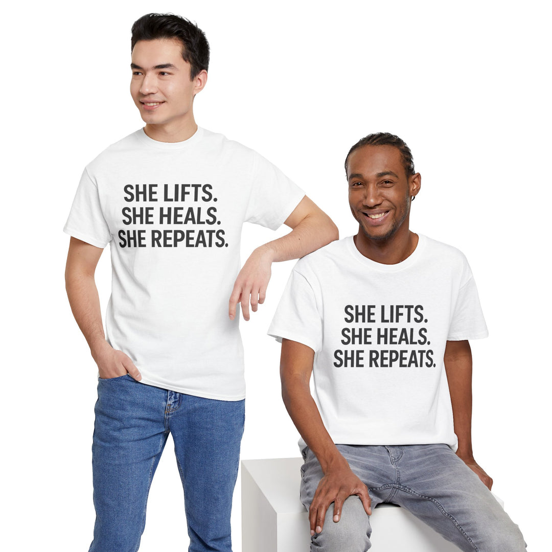 She Lifts. She Heals. She Repeats.  Unisex Heavy Cotton Tee