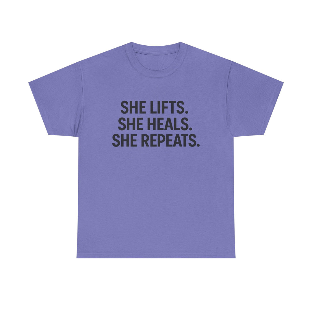 She Lifts. She Heals. She Repeats.  Unisex Heavy Cotton Tee