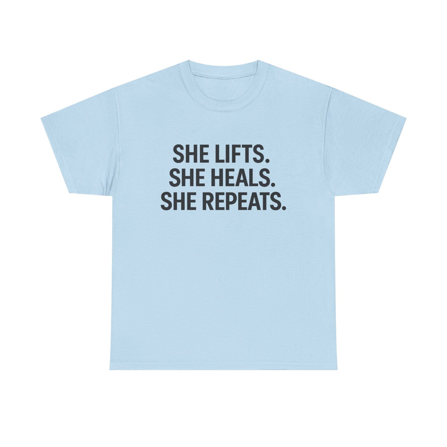 She Lifts. She Heals. She Repeats.  Unisex Heavy Cotton Tee