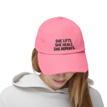 She Lifts. She Heals. She Repeats. : Unisex Distressed Cap