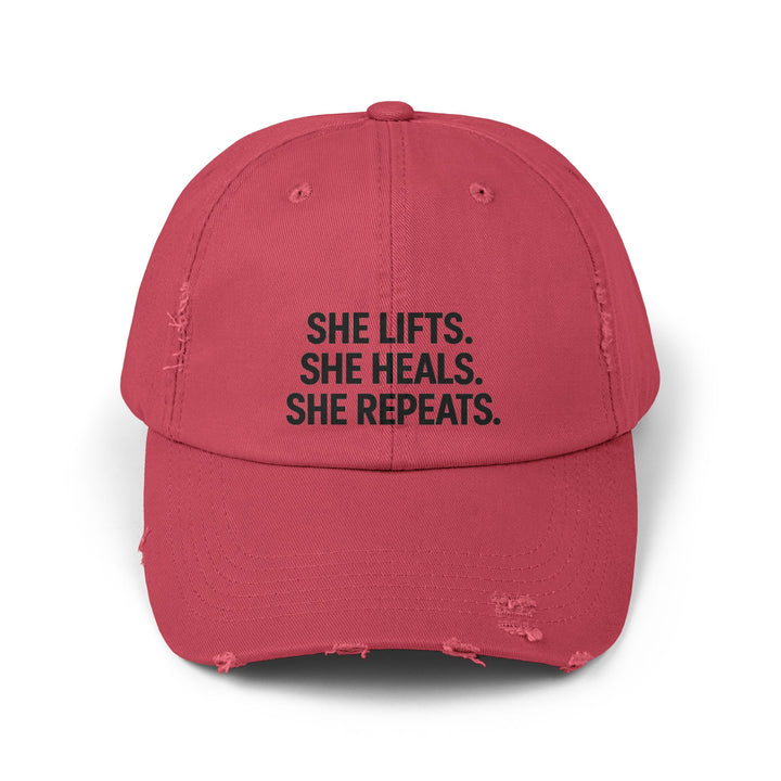 She Lifts. She Heals. She Repeats. : Unisex Distressed Cap