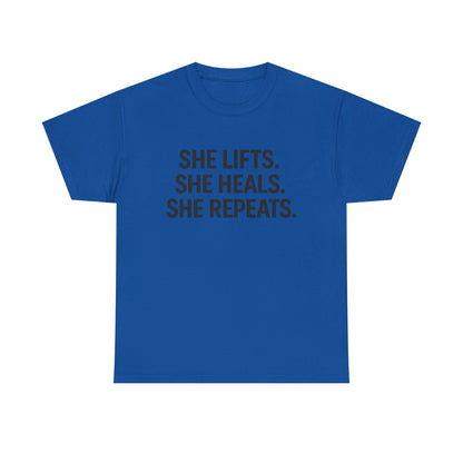 She Lifts. She Heals. She Repeats.  Unisex Heavy Cotton Tee