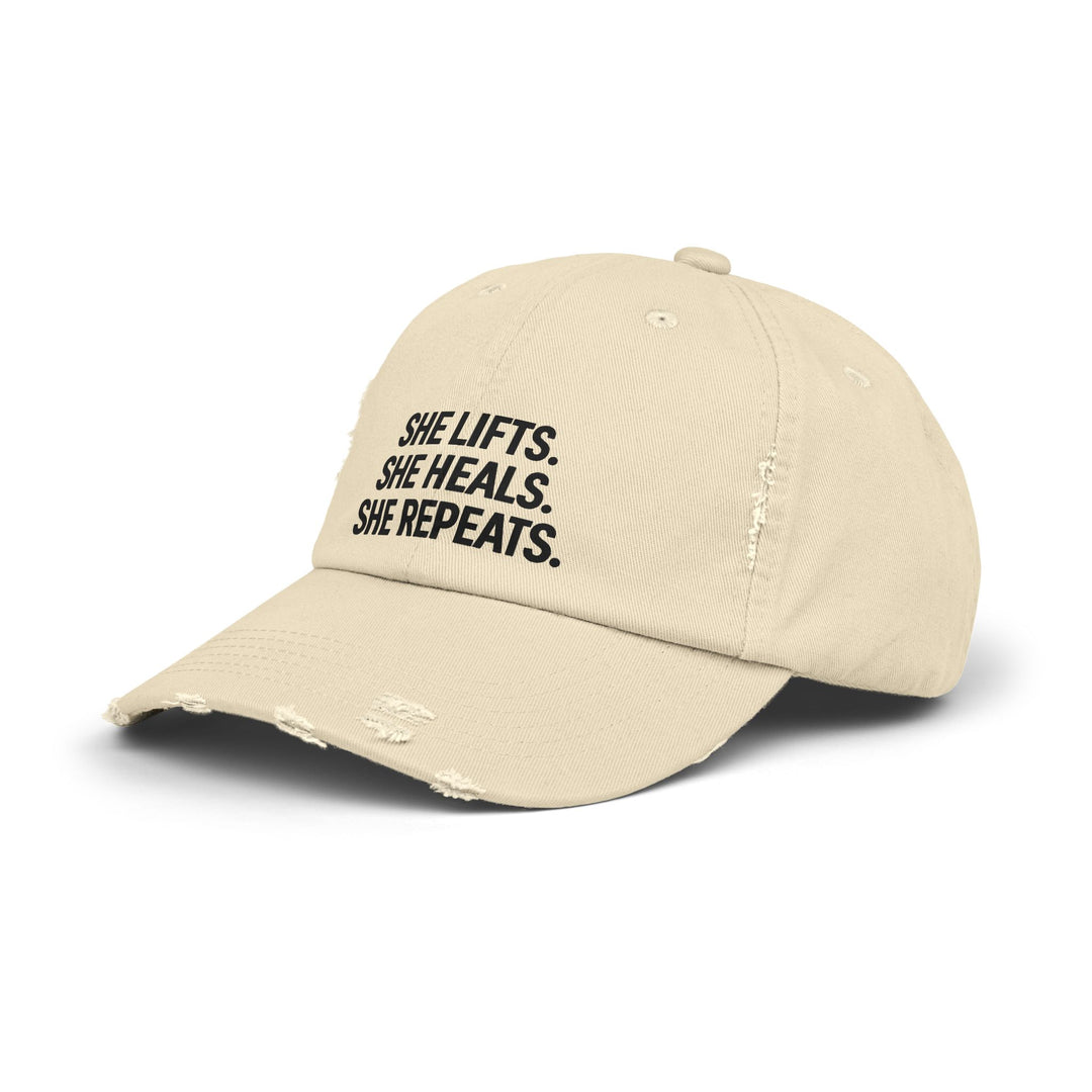 She Lifts. She Heals. She Repeats. : Unisex Distressed Cap