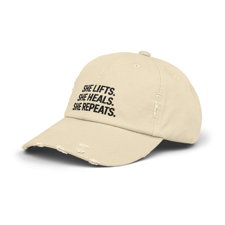 She Lifts. She Heals. She Repeats. : Unisex Distressed Cap