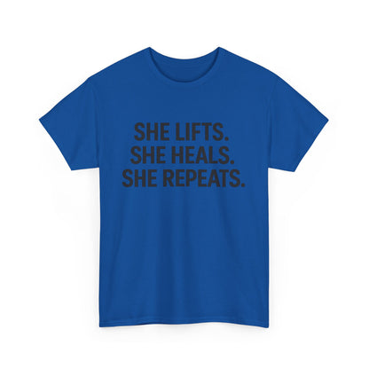 She Lifts. She Heals. She Repeats.  Unisex Heavy Cotton Tee
