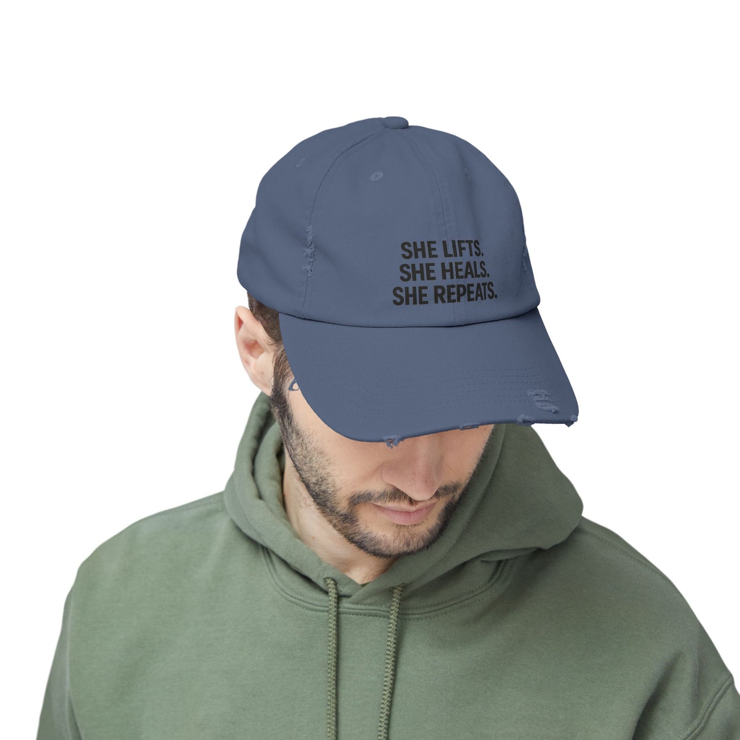 She Lifts. She Heals. She Repeats. : Unisex Distressed Cap