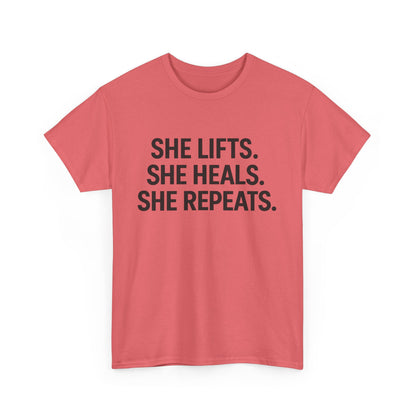 She Lifts. She Heals. She Repeats.  Unisex Heavy Cotton Tee