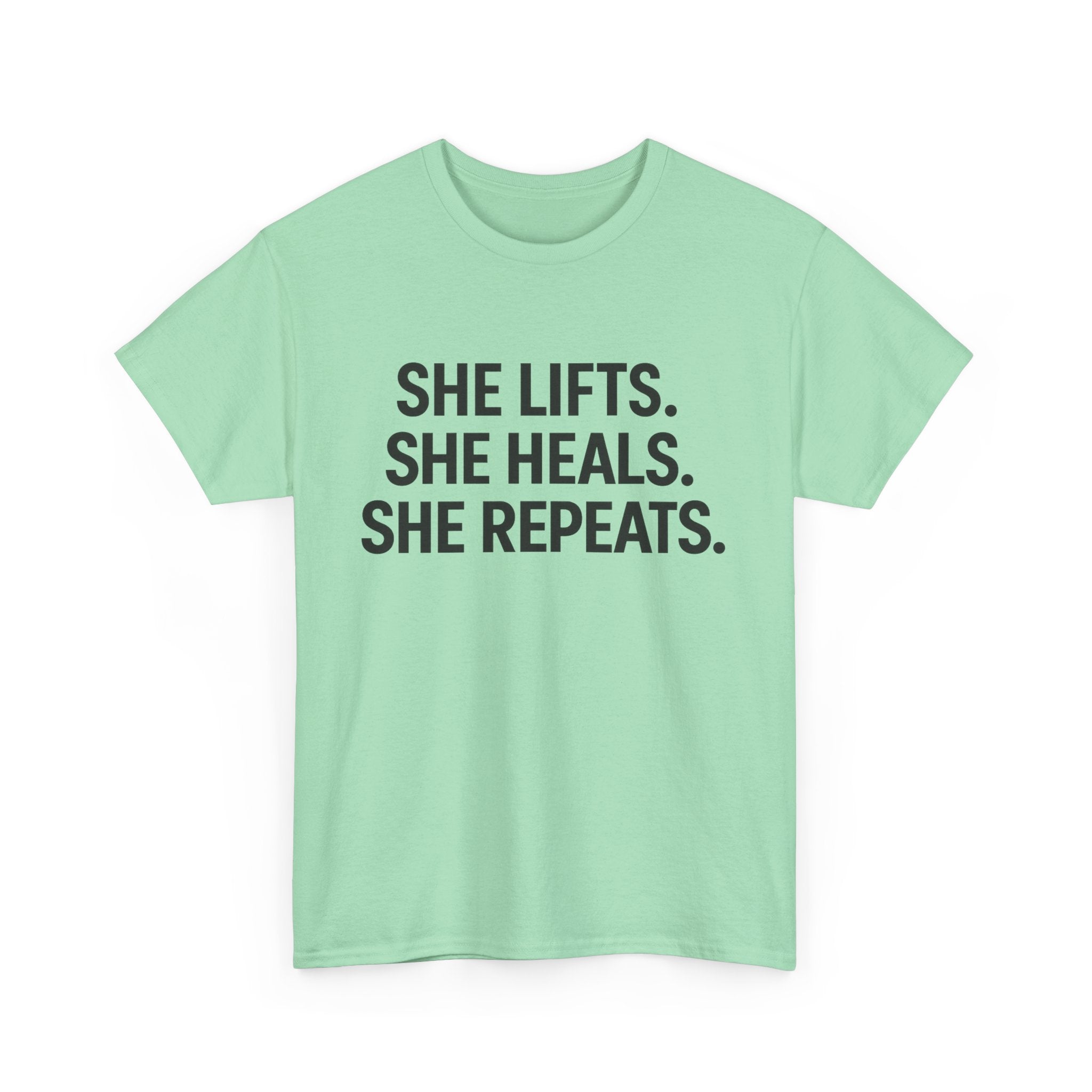 She Lifts. She Heals. She Repeats.  Unisex Heavy Cotton Tee