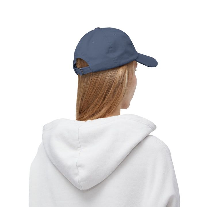 She Lifts. She Heals. She Repeats. : Unisex Distressed Cap