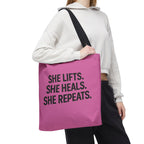 She Lifts. She Heals. She Repeats. Tote Bag