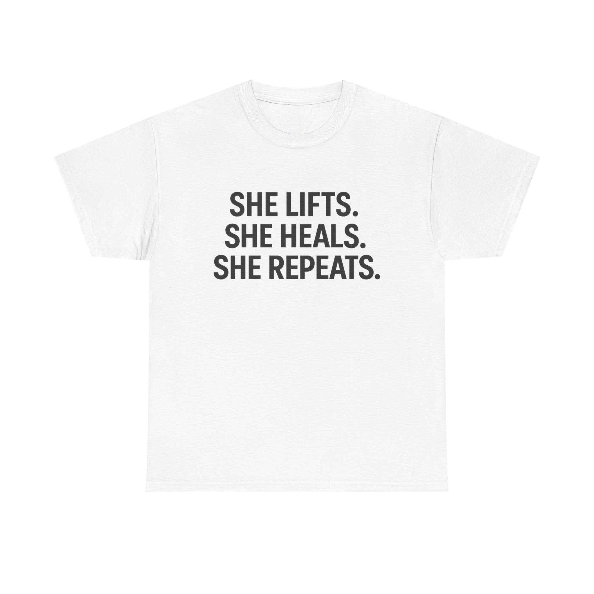 She Lifts. She Heals. She Repeats.  Unisex Heavy Cotton Tee
