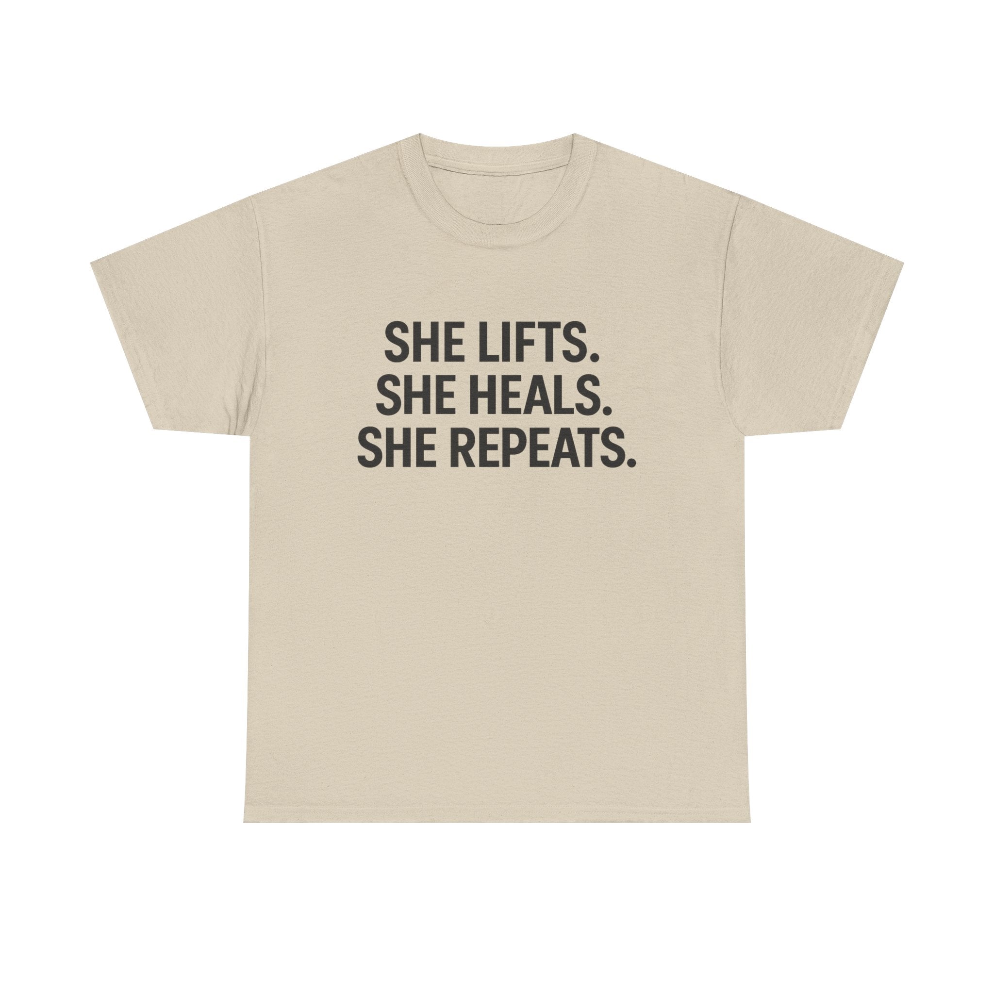 She Lifts. She Heals. She Repeats.  Unisex Heavy Cotton Tee