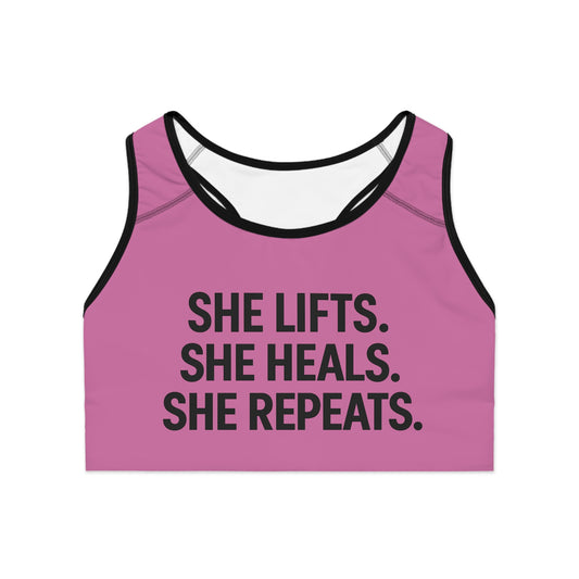 She Lifts. She Heals. She Repeats. Sports Bra